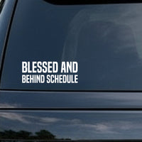 White text reading Blessed And Behind Schedule in bold block letters on a solid black background