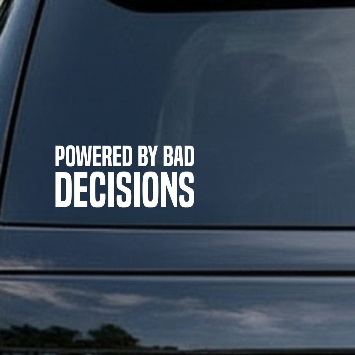 White block letters on a black background spelling out the phrase Powered By Bad Decisions in two lines with bold, simple font.