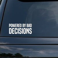 White block letters on a black background spelling out the phrase Powered By Bad Decisions in two lines with bold, simple font.