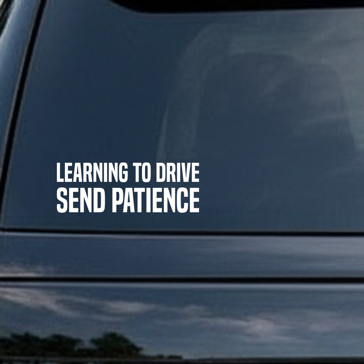 White bold text reading 'Learning To Drive Send Patience' on a black background in a simple block font