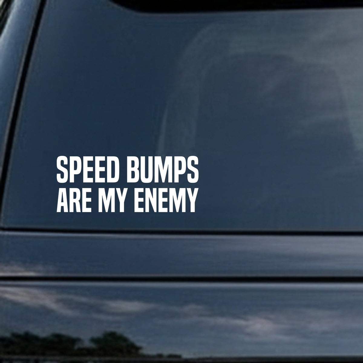 White bold capital letter vinyl decal reading Speed Bumps Are My Enemy on black background in block font
