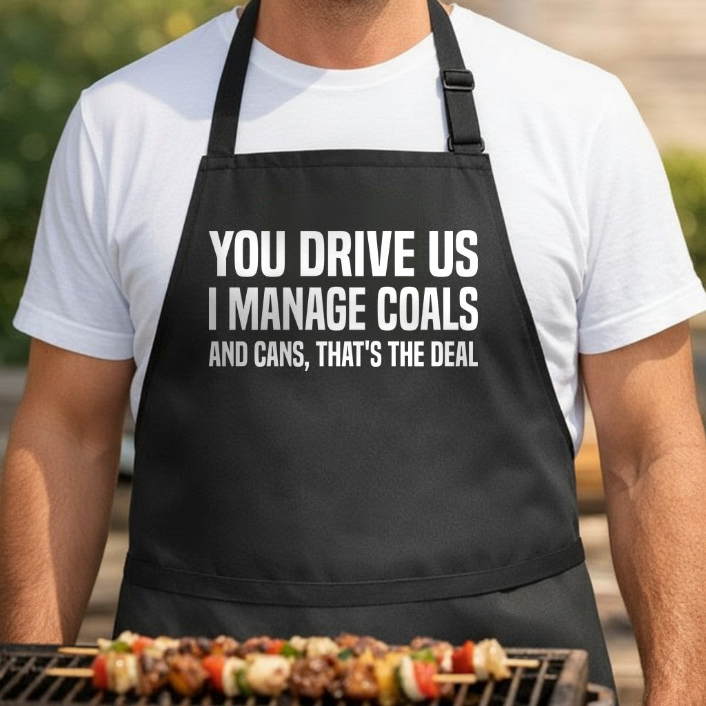 Black apron with large white text reading You Drive Us I Manage Coals And Cans That’s The Deal in a bold block font