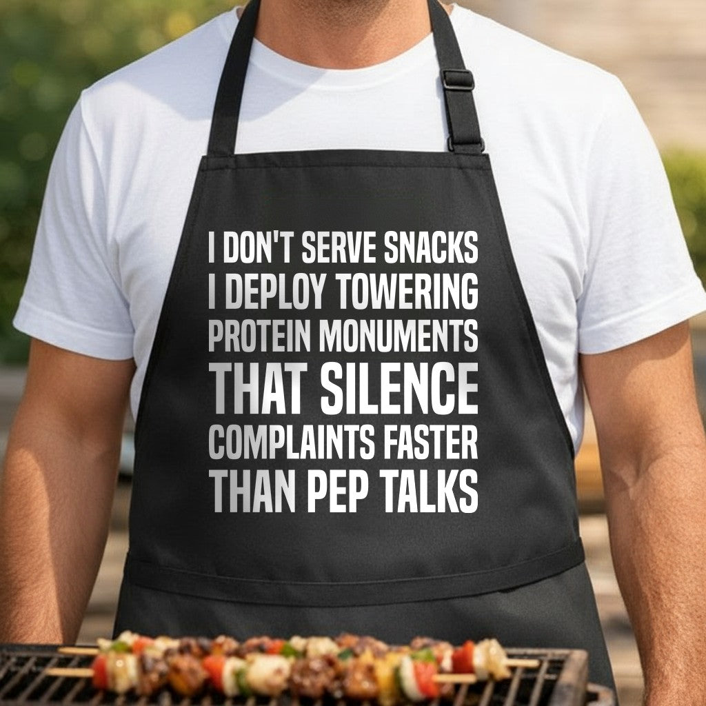 Black apron with large white bold text reading a humorous quote about serving towering protein monuments to silence complaints.