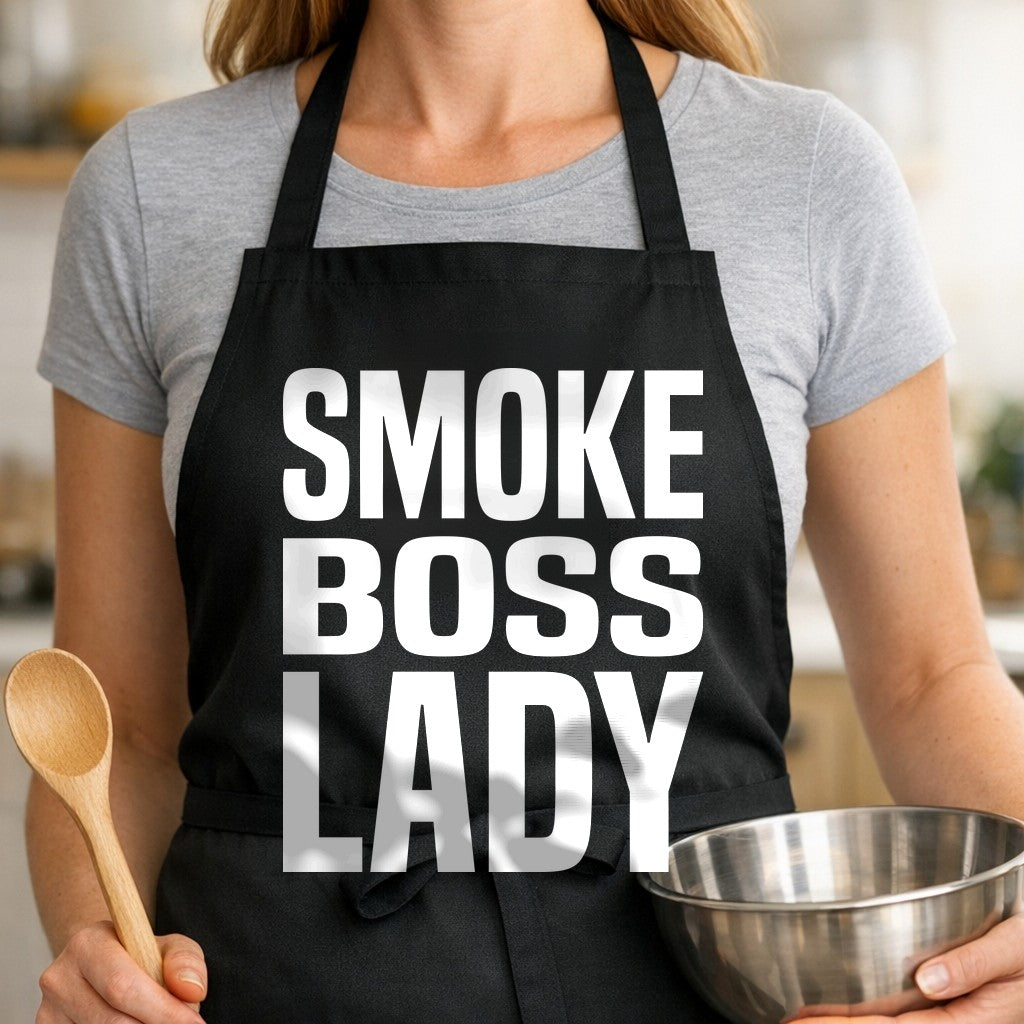Black apron with bold white block text reading Smoke Boss Lady in three lines, simple graphic style.
