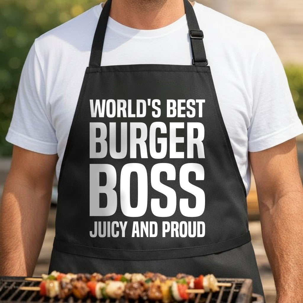 Black apron with large white bold text reading 'World's Best Burger Boss Juicy And Proud' centered on front