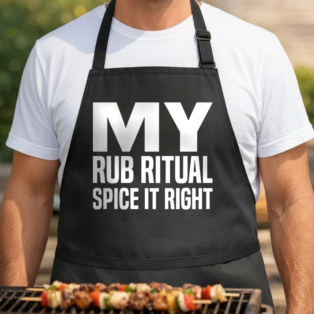 Black apron with large bold white text that reads My Rub Ritual Spice It Right in a clean modern font
