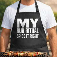 Black apron with large bold white text that reads My Rub Ritual Spice It Right in a clean modern font