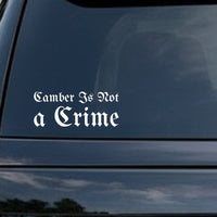 White gothic blackletter lettering saying 'Camber Is Not A Crime' on a black background in bold Old English style font.