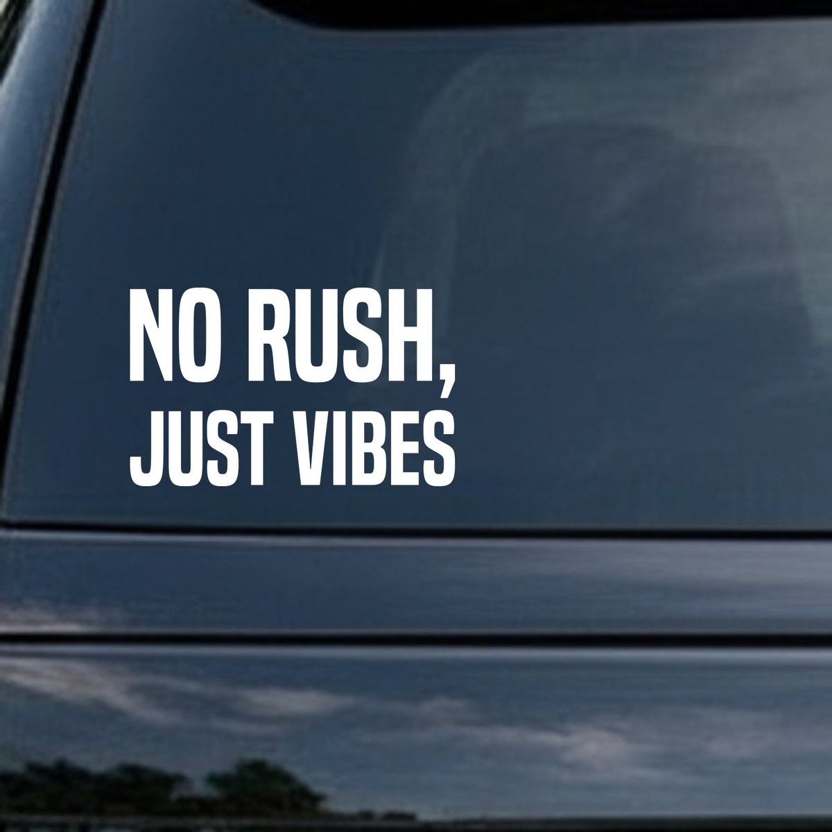 White block letters spelling No Rush, Just Vibes on a solid black background in a bold sans serif font