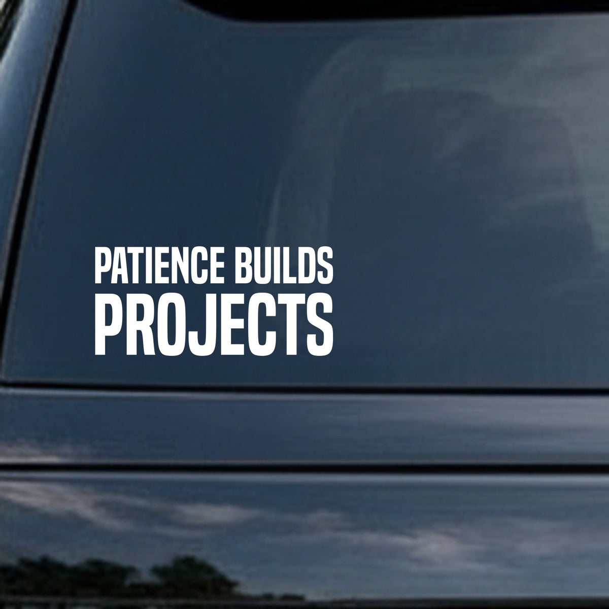 White bold block letters spelling 'Patience Builds Projects' on a black background in two lines.