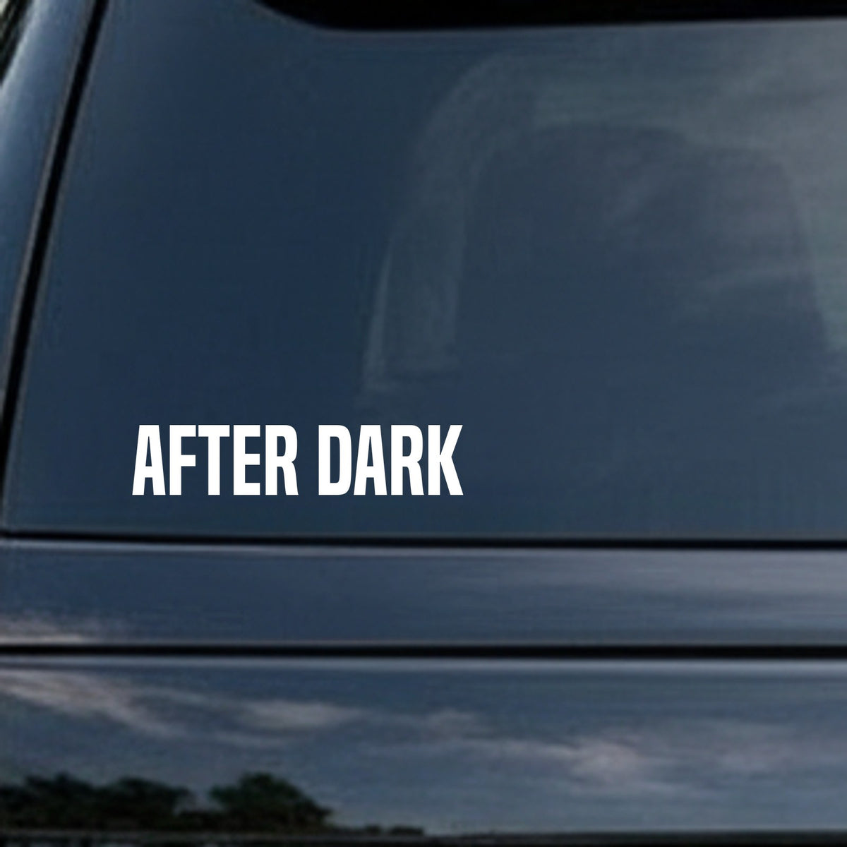 White bold capital letters spelling 'AFTER DARK' on a black background in a clean, sans-serif font style