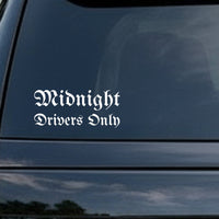 White vinyl decal with the phrase Midnight Drivers Only in gothic blackletter Old English font on a black background