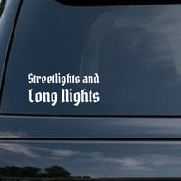 White gothic blackletter text saying Streetlights and Long Nights on a black background in Old English style font.