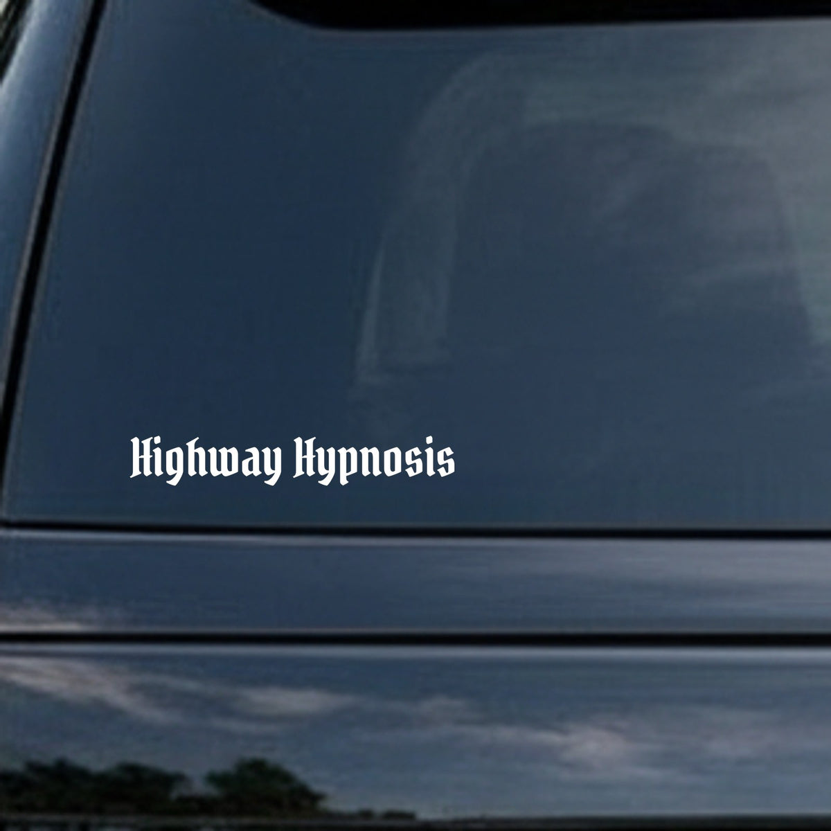 White gothic blackletter Old English style lettering spelling 'Highway Hypnosis' on a black background, centered text design