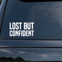 White bold block letters reading 'LOST BUT CONFIDENT' on a solid black background in a simple sans serif style.