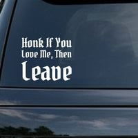White gothic blackletter text saying Honk If You Love Me Then Leave on a black background in bold Old English style font