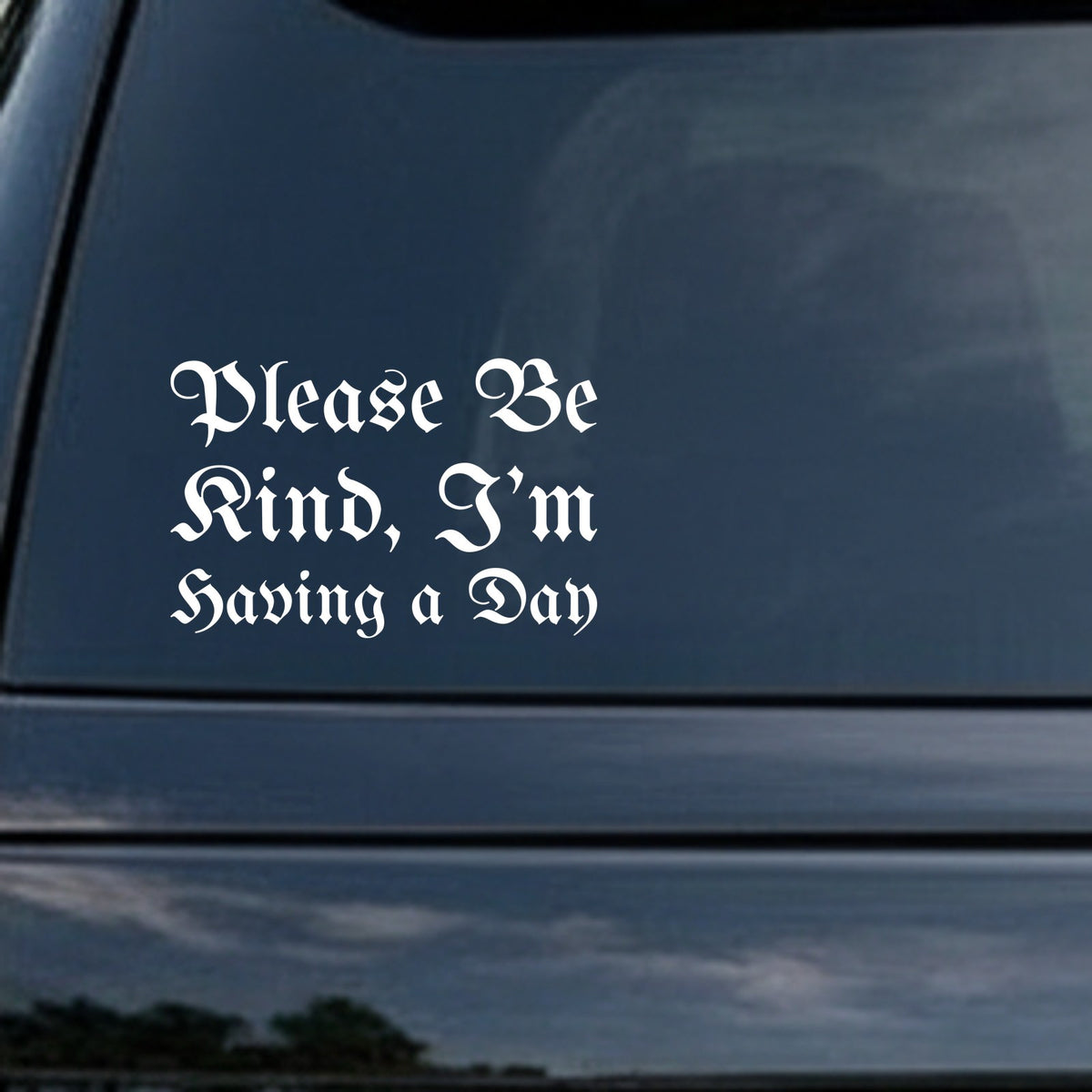 White gothic blackletter text saying 'Please Be Kind, I'm Having A Day' on a solid black background