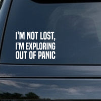 White vinyl decal with bold uppercase text saying I'M NOT LOST I'M EXPLORING OUT OF PANIC on black background
