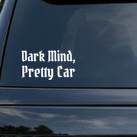 White gothic blackletter style lettering saying Dark Mind, Pretty Car on a black background in two lines.