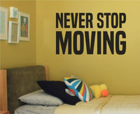Black vinyl wall decal with the motivational saying 'Never Stop Moving' in a bold, modern font on a white background