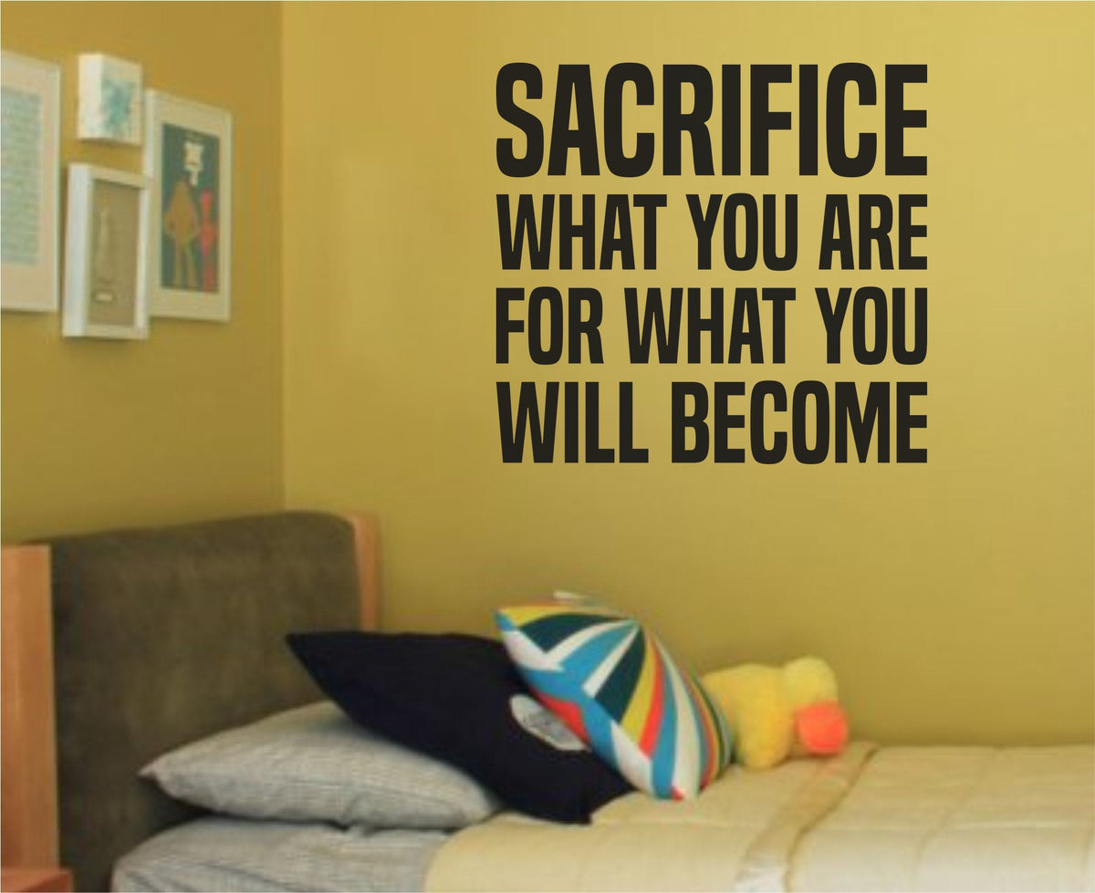 Black vinyl wall decal with the quote Sacrifice What You Are for What You Will Become in bold clean font on white background