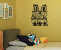 Black silhouette wall decal of a gothic cathedral with twin towers, detailed arches, and rose window in a line art style