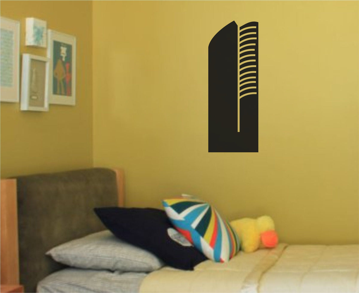 Black vinyl silhouette of a modern curved Düsseldorf building with horizontal window lines on a white background.