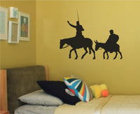 Black silhouette of Don Quixote riding a horse with a lance and Sancho Panza sitting on a donkey, side profile on white background.