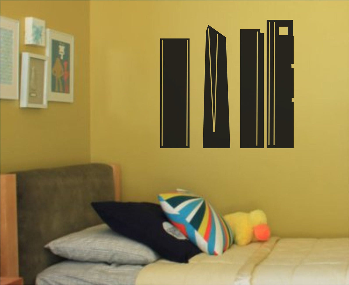 Black silhouette vinyl wall decal showing four modern high-rise buildings from Madrid in a minimalist style on white background