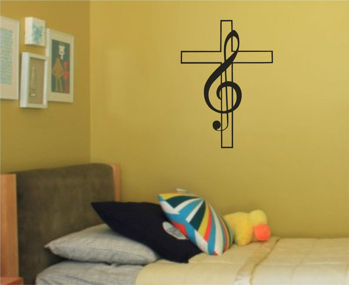Black vinyl wall decal of a treble clef wrapped around a Christian cross on white background in simple line art style