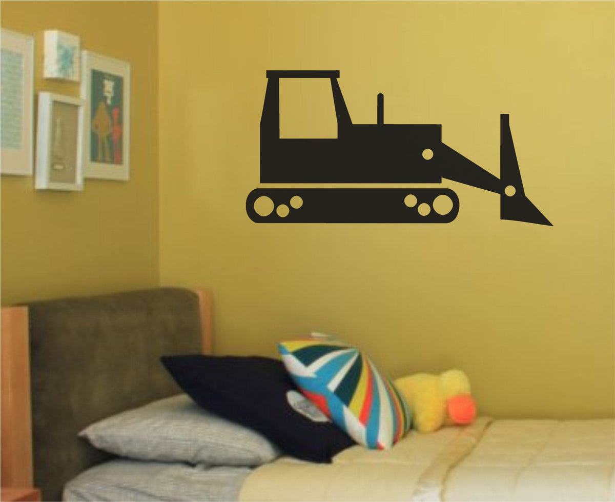 Black silhouette of a bulldozer vehicle with a large blade and tracks on a white background in a simple graphic style.
