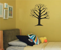 Black silhouette of a leafless tree with many branches spreading outward on a white background in simple graphic style.