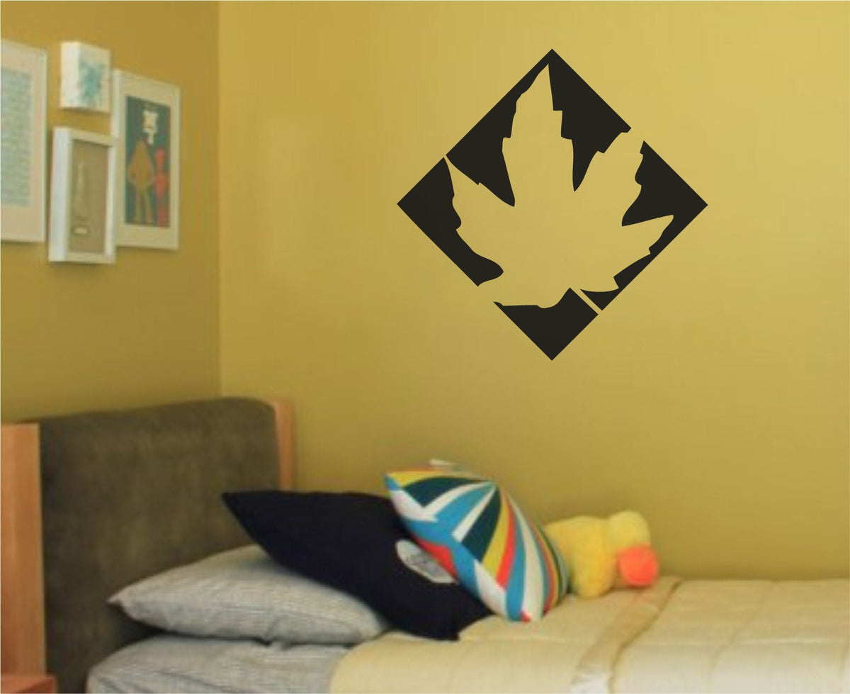 Black and white silhouette of a maple leaf inside a diamond shape with sharp edges in a simple graphic style.