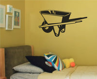 Black and white silhouette of a wheelbarrow with one wheel and two handles in a simple bold vector style.