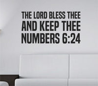 Black vinyl wall decal showing the Bible verse 'The Lord Bless Thee And Keep Thee' in Built Titling font on a white background.