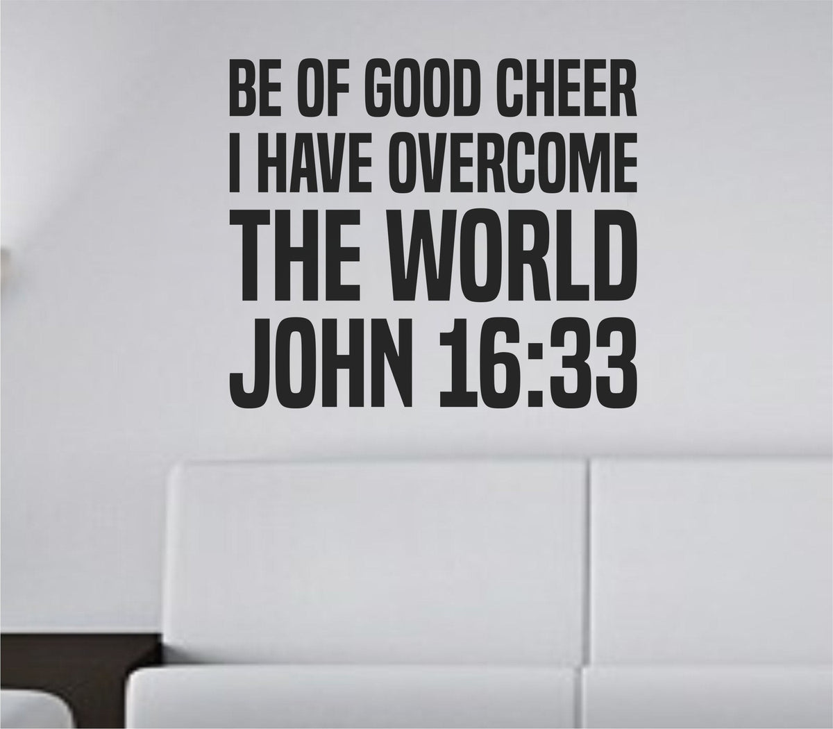 Black vinyl wall decal with bold tall block letters showing John 16:33 scripture quote in a clean modern style.