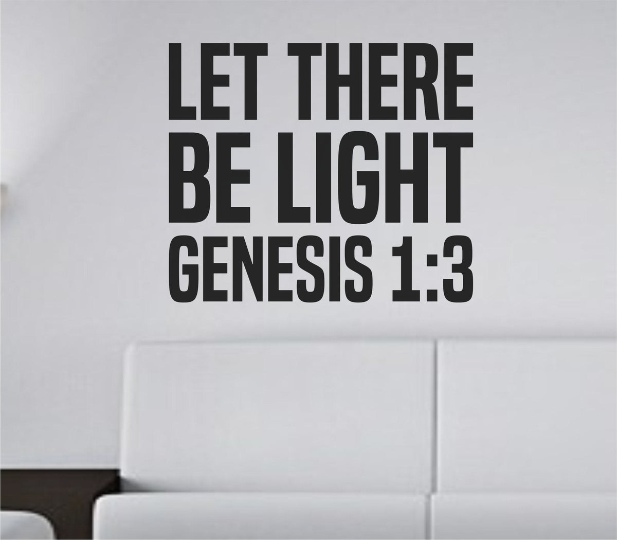 Black vinyl wall decal with the text LET THERE BE LIGHT in bold tall block letters on a white background