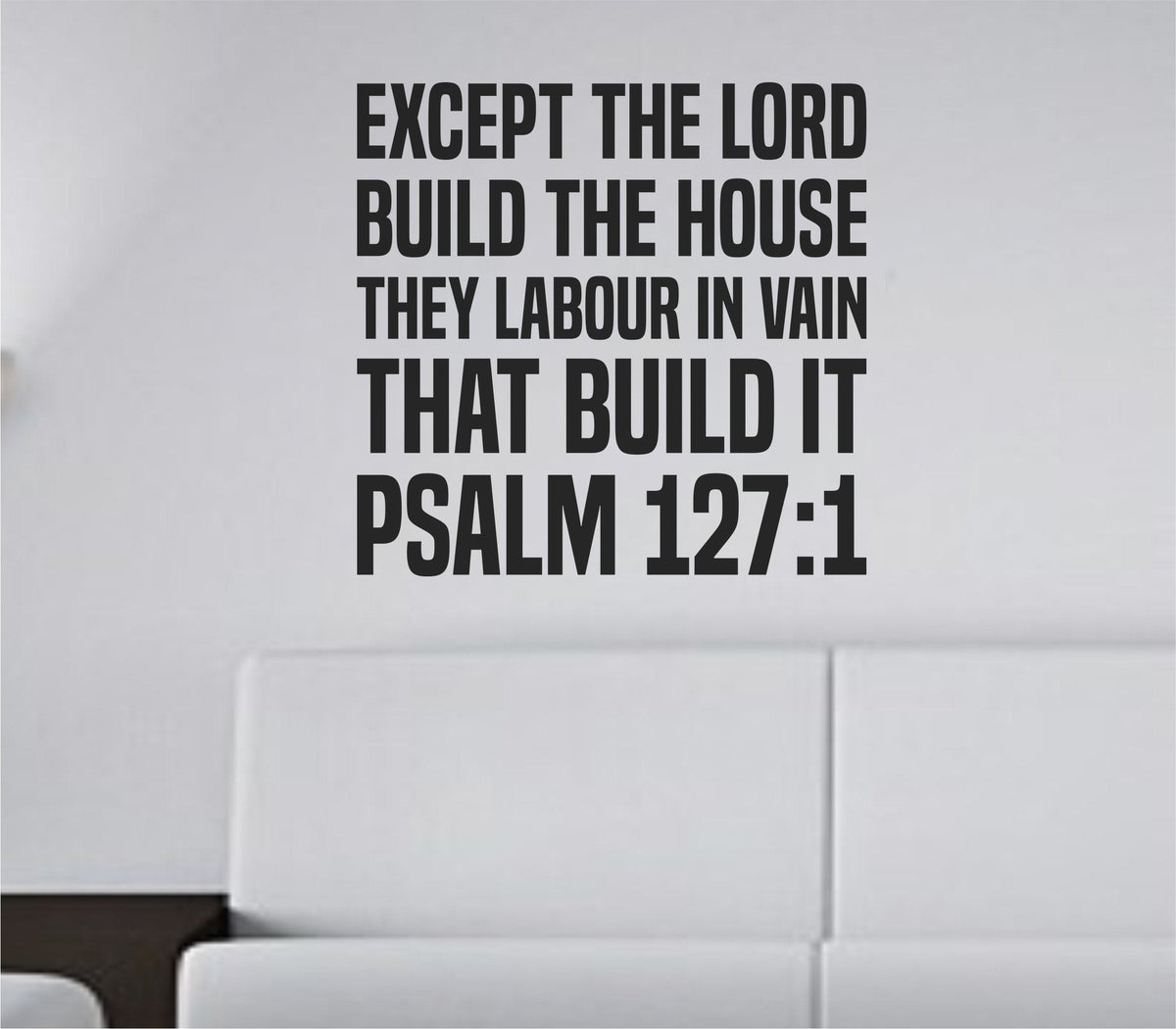 Black bold tall block lettering wall decal of Psalm 127:1 scripture on a white background in a simple rectangular layout.