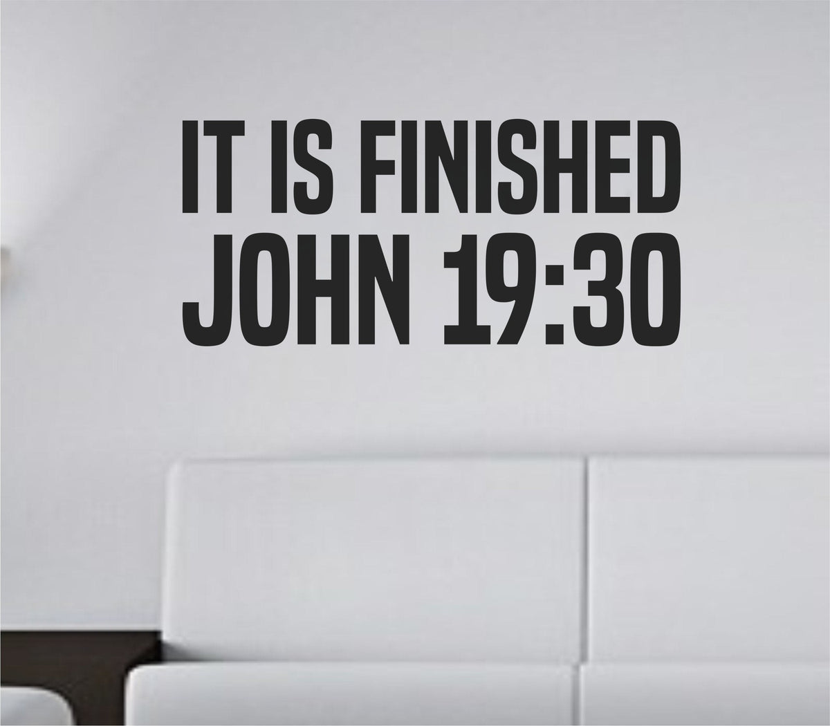 Black vinyl wall decal with the words IT IS FINISHED in bold tall block letters on a white background
