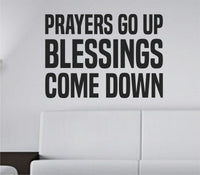 Black bold tall block lettering wall decal with the phrase Prayers Go Up Blessings Come Down on white background.