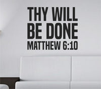 Black vinyl wall decal with bold tall block letters reading 'THY WILL BE DONE' from Matthew 6:10 Bible verse