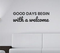 Black vinyl wall decal quote saying Good days begin with a welcome on a white background in simple modern font