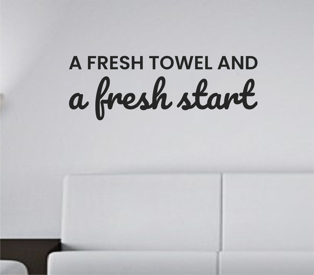 Black vinyl wall decal with the quote 'A fresh towel and a fresh start' in clean simple font on a white background