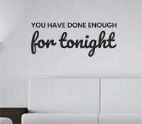 Black vinyl wall decal with the quote 'You have done enough for tonight.' in simple, modern font on a white background