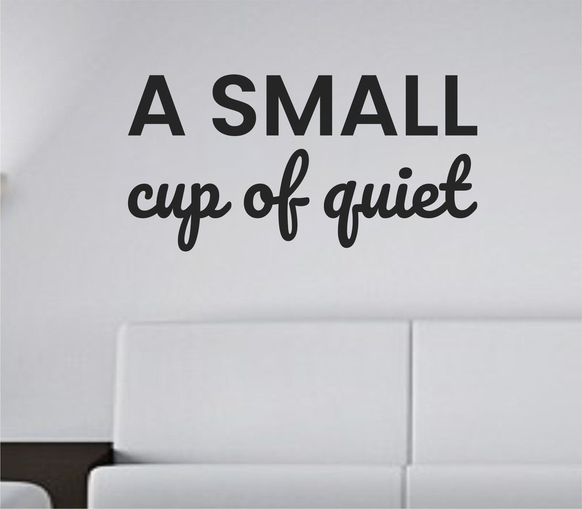 Black vinyl wall decal with the phrase 'A small cup of quiet.' in simple, clean lettering on a white background.