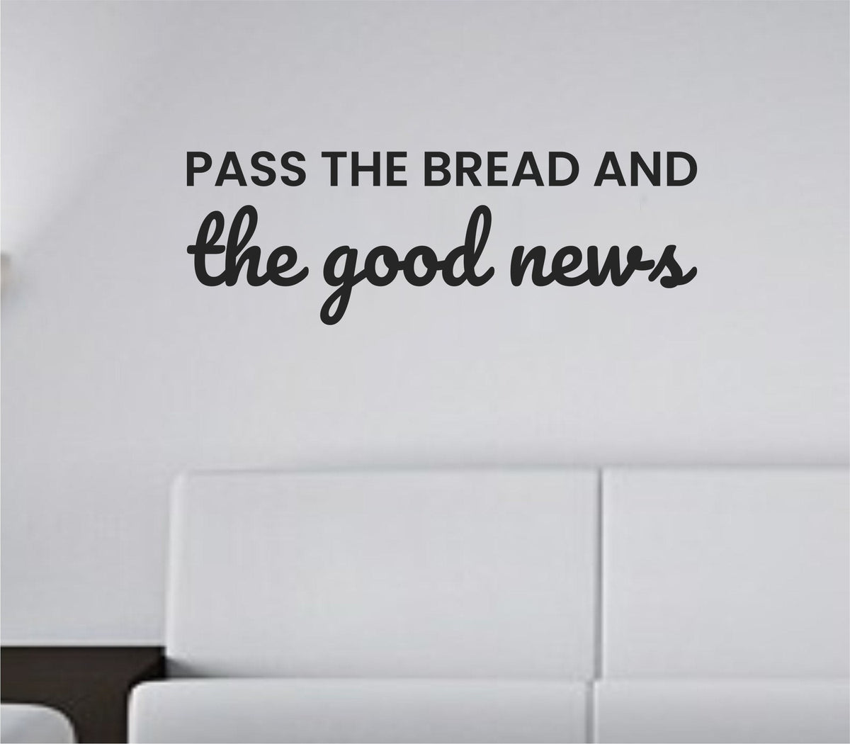 Black one-color vinyl wall decal with the quote 'Pass the bread and the good news' in simple modern font on white background