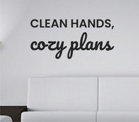 Black vinyl wall decal with the phrase 'Clean hands, cozy plans.' in simple script, on a white background.