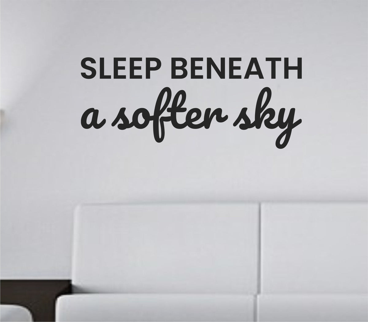 Black vinyl wall decal with the quote ‘Sleep beneath a softer sky’ in a simple, elegant script on a white background.