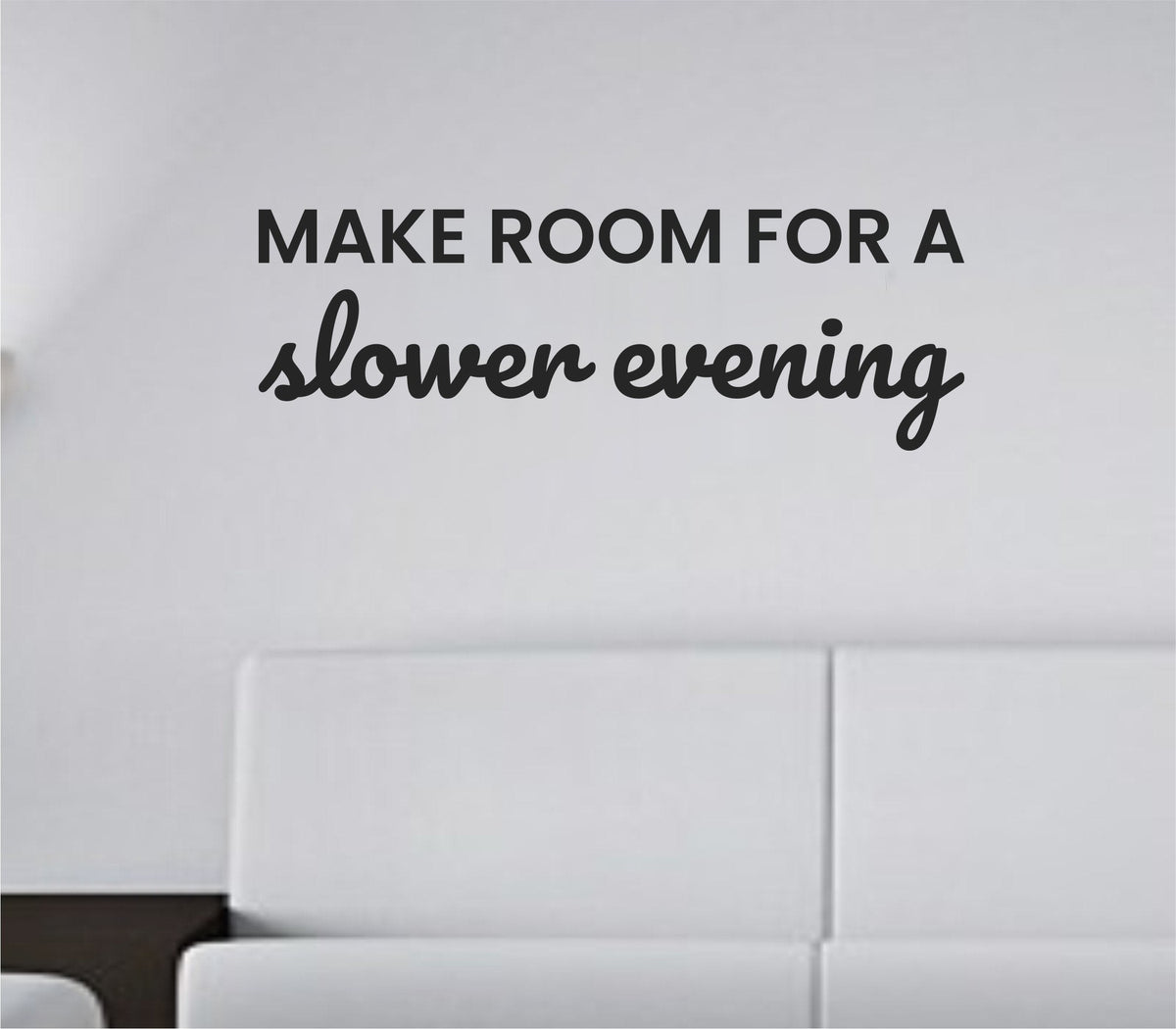 Black vinyl wall decal with the phrase 'Make room for a slower evening' in simple modern font on white background