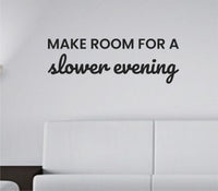 Black vinyl wall decal with the phrase 'Make room for a slower evening' in simple modern font on white background